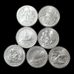 NUMISMÁTICA, Lote 7 Moedas Quarter Dollar - Valor de mercado R$ 70 - Parques: Fort Moultrie; Shenandoah; Hawaii Volcanoes; Ellis Island; Mount Rushmore; Fort McHenry; Effigy Mounds | National Park