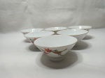 Jogo de 6 cumbucas bowls em porcelana japonesa, com pintura de ave sob galho. Medindo 12cm x 5,5cm de altura. Um deles com pequeno bicado na base.