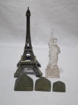 Lote composto de torre Eiffel em metal, estatua da liberdade em acrílico e 3 piramides em bronze. Medindo a torre 18,5cm de altura.