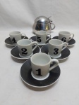 Lote de 6 xícaras de café 2 goles em porcelana e 1 açucareiro em aço inox. Medindo o açucareiro 8cm de altura.