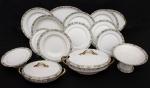 Limoges - Antigo aparelho de jantar incompleto em porcelana francesa da manufatura de Limoges possivelmente cerca de 1900, bordas decoradas com flores e folhagens policromadas com frisos a folha de ouro, marca da manufatura na base constando de Trinta pratos rasos - med. 25 cm de diâmetro (três pratos com defeitos sendo dois restaurados e um com bicado na borda), um prato fundo - med. 25 cm de diâmetro (com bicado na borda), sete pratos de sobremesa - med. 23 cm de diâmetro (um com fio de cabelo), uma sopeira - med. 17x37x19 cm (borda interna com colado na lateral), uma legumeira com tampa - med. 12x31x17 cm, uma saladeira (com fio de cabelo na borda) - med. 12x29 cm de diâmetro, uma travessa redonda para arroz - med. 6x29 cm de diâmetro, três travessas redondas - med. 4,5x29 cm de diâmetro (duas) e med. 4,5x32 cm de diâmetro (uma), duas travessas ovais - med. 4x35x25 cm e 4x42x29 cm, dois pratos para doces - med. 7,5x23 cm de diâmetro e uma fruteira de pé alto - med. 13x23 cm de diâmetro - Total de 50 peças (dourado da folha de ouro com desgastes do tempo e de uso)