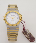 Technos - Saphirre 5 ATM - Relógio de pulso feminino e com caixa e pulseira em aço e dourado, mostrador branco pontilhado - Day Date - Movimento Quartz - caixa med. 3,5x3,5 cm. Relógio sem uso, ainda com etiquetas. Máquina sem garantia de funcionamento.