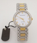 Technos - Saphirre  - Relógio de pulso feminino e com caixa e pulseira em aço e dourado, mostrador branco pontilhado - Day Date - Movimento Quartz - caixa med. 3,5x3,2 cm. Relógio sem uso, ainda com etiquetas. Máquina sem garantia de funcionamento.