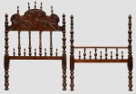 ANTIGA CAMA em Jacarandá, lavrada em estilo barroco português. Extremidades ornadas por balaústres e bilros alternados, sendo a cabeceira rematada por painel recortado,esculpido com arabescos e encimado por ponteiras. Colunas laterais, torneadas e aneladas acompanhando a decoração. Estrado retangular com fundo de molas e montantes lisos.Século XVIII.  Ver no livro cama semelhante como referência "O Móvel no Brasil", Tilde Canti, Pag. 136 Ilustração 116 e 117.  Med. Alt. 1,45 m Compr. 2,34 m e Larg. 1,05 m. OBS: (Apresenta restauro na parte superior da coluna direita).