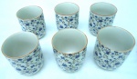 6 copinhos de porcelana Japão - ricamente decorados - mede cada : 8 alt x 6 cm diam filetados