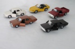 COLECIONISMO - Cinco carrinhos miniatura em metal, porta móvel, roda de fricção manufaturas diversas: Willians Dauphine, Puma Gts, Dodge Dart, Ford Galaxy, F 100. . Med. aproximada 11 cm cada.