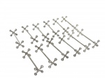 <B>CHRISTOFLE (França)</b>, doze (12) descansos de talheres confeccionados em metal francês espessurado a prata, com laterias no formato de X, medindo 8cm de comprimento.