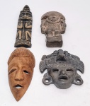 Lote composto por 4 máscaras étnicas do mundo, sendo uma africana em madeira, uma nacional em técnica mista, uma peruana em cerâmica e uma mexicana em cerâmica. Ambas em bom estado de conservação, maior mede 30,0 cm de altura.