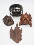 Lote composto por 4 máscaras de origem oriental, executadas em madeira de ótima qualidade, expressivas e ricas em movimentos. Bom estado de conservação, maior mede 15,5 x 12,0 cm.