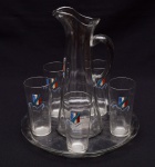 ESPOIR ALSACE LORRAINE - Conjunto de 1 jarra, 1 bandeja e 5 copos, em vidro translúcido. Altura da jarra: 30cm; Copos: 13cm; Diâmetro do prato: 28cm.