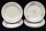 Lote composto de 6 pratos para sobremesa em porcelana esmaltada e vitrificada na cor branca, com decoração floral e fio dourado nas bordas. Diâmetro: 19,5cm.