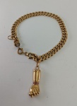 Pulseira corrente em ouro amarelo 14 k com pingente figa. Peso 16,2 gr Med. 17 cm (pulseira)
