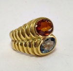 Anel em ouro amarelo 18k com topazio e citrino. Peso 10,5 gr Aro 8