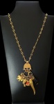 JOIA DE CRIOULA: Colar em ouro amarelo 14 k com balangandãs em coral e marfim. Peso Total . 35 gr . Med. 60 cm (colar)