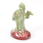 Grupo escultórico em porcelana esmaltada e vitrificada representando Garças, altura 16 cm.