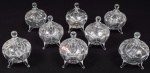 Conjunto de 8 bombonieres em vidro com tampa. Diâmetro: 9 cm. Altura: 13 cm.