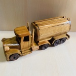 Peça decorativa feita em madeira representando caminhão tanque. Medindo 9 cm de Largura x 12 cm de Altura x 29 cm de Profundidade.