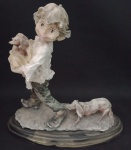 Escultura em resina representando menino com cachorro . Medindo : 26 x 12 x 25 cm .