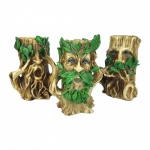 Trio de castiçais sábios, cego, surdo e mudo, em formato de árvores confeccionado em resina. Medidas: Comprimento: 7 cm Largura: 9 cm Altura: 11 cm.