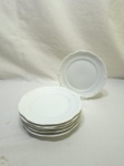 Jogo de 6 pratos de sobremesa em porcelana branca borda trabalhada. Medindo 19,5cm de diâmetro.