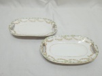 Par de petisqueiras ovais rasas em porcelana portuguesa Vista Alegre. Medindo 17,5cm x 10,5cm.
