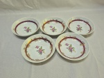 Jogo de 5 cumbucas em porcelana Schmidt floral, vinho com ouro. Medindo 13,5cm x 3,5cm de altura. Peça com leves desgaste no friso.