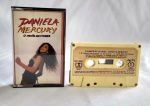 Antiga e Conservada Fita Cassete - K7 - O CANTO DA CIDADE - Daniela Mercury - Medida: 11 x 7 x 1,5 cm.