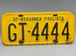 COLECONISMO - Placa automotiva em ferro - Amarela - SP - Bragança Paulista - GT 4444 - Med. 16x35 cm.