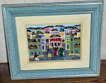 Quadro com pessoas e casas coloridas que remetem ao Pelourinho, assinatura `Gutemberg` em moldura belíssima em tom azul claro - dim - 42x36x3