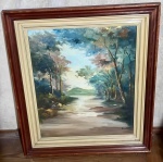 Quadro de caminho entre as árvores com montanha ao fundo emoldurado em madeira de tom claro e escuro e assinado `Dayse Soares` - dim- 54x61x7