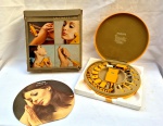 Aparelho massageador Phiilips Beauty Set  no estojo original e na embalagem mais sem garantia de funcionamento medindo 7 cm por 23 cm de diâmetro.