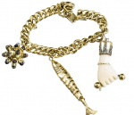 PULSEIRA COM GRANDE PINGENTE PEIXE ARTICULADO EM OURO 18K.FIGA EM MATERIAL ORGÂNICO COM DETALHES EM