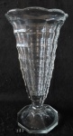 Gracioso vaso translúcido, formato cônico, em Demi Cristal com lapidações curvilíneas. Base circular com lapidação estrela e borda recortada no formato de polígono. Exemplar de coleção e em excelente estado. Dimensões: 28 cm x 14,5 cm / 1850 g.
