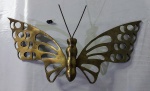 Exuberante borboleta em bronze polido, com riquíssimos detalhes e ostentando belíssimos vazados. Dimensões : 17x37 cm.
