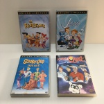 Parte de coleção com quatro DVDs, gênero desenho animado antigo.