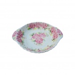 Travessa Weiss em porcelana com decoração floral, apresenta fio de cabelo. Alt. 5cm e diam. 24cm.