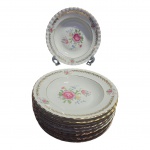 Dez pratos para sopa em porcelana marca Steatita, decoração floral e douração, med. Diam. 23cm.