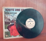 Disco de Vinil com marcas do tempo.