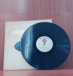 Disco de Vinil com marcas do tempo.