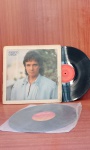 Disco de Vinil com marcas do tempo.