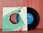 Disco de Vinil com marcas do tempo.