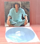Disco de Vinil com marcas do tempo.