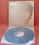 Disco de Vinil com marcas do tempo.