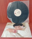 Disco de Vinil com marcas do tempo.