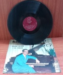 Disco de Vinil com marcas do tempo.