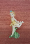 Antigo Anjinho em Resina decorado em cores diferenciadas Passeando em Flores , com 10cm em Alt,