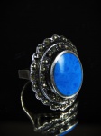 Anel de prata 925 , base com turquesa e moldura de marcassitas. Base 2,5 cm.  Aro 14