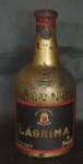 Garrafa de Coleção vinho Lágrima, Vinho do Porto, Real vinícola, Safra de 1936, acondicionado em garrafa pintada a ouro. Para coleção com lacre original. sem garantia de uso. Alt. 23cm