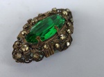 Antigo broche . Material não identificado . Comprimento 6,5 cm.