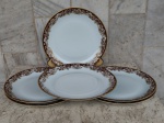 Seis pratos principais de porcelana Renner de Porto Alegre , design Mon Cheri , branco com bordas floridas no tom ocre e frisos  em ouro brunido. Diâmetro 24,5 cm.